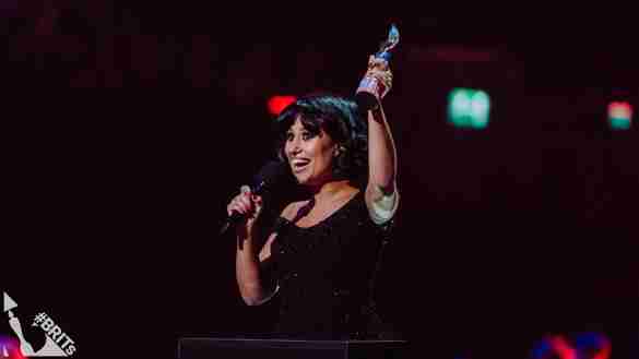 RAYE accepting her BRIT Award for Song of the Year