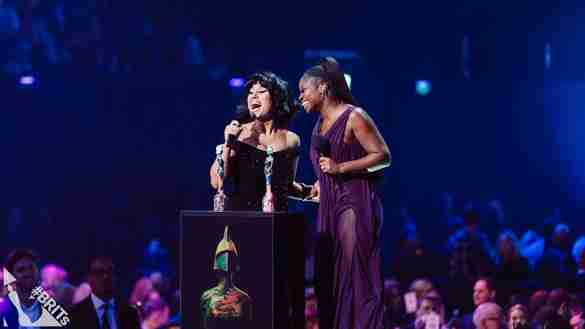 Raye with Clara Amfo at the BRIT Awards 2024